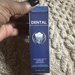 Dental Cavity Healing Tooth Armor, a liquid enamel refurbishing solution.